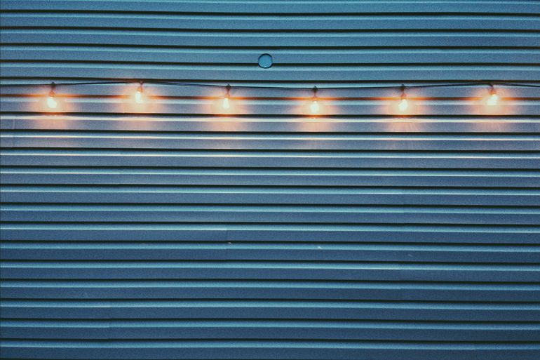 Light bulbs on the blue wall.